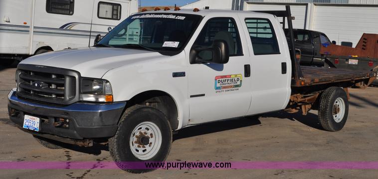 image for item C3129 2002 Ford F350 XL Super Duty flatbed truck