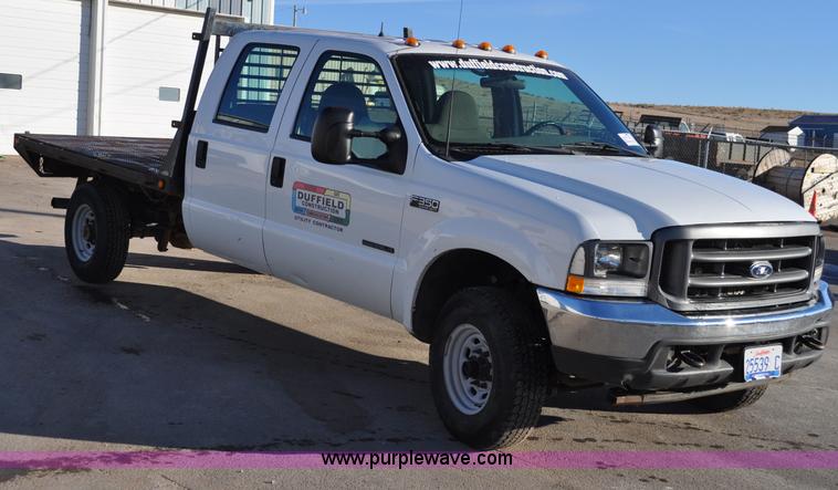 image for item C3129 2002 Ford F350 XL Super Duty flatbed truck