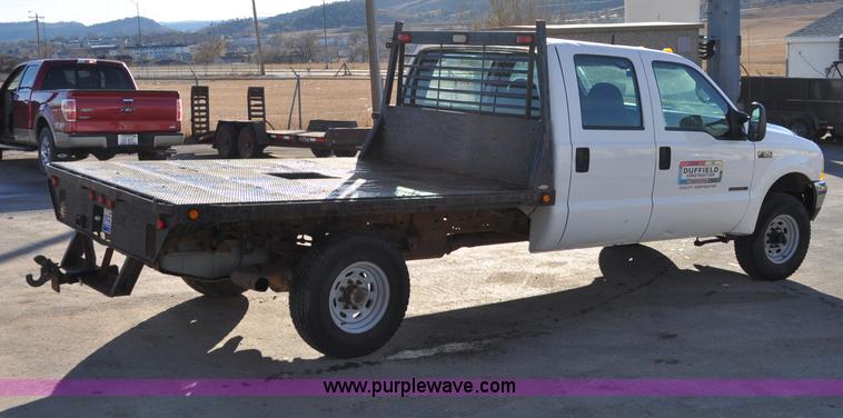 image for item C3129 2002 Ford F350 XL Super Duty flatbed truck