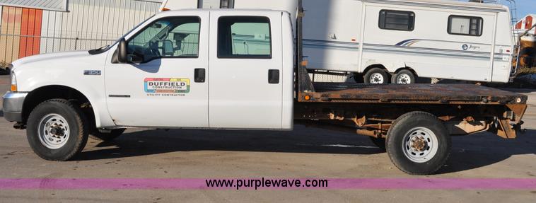 image for item C3129 2002 Ford F350 XL Super Duty flatbed truck
