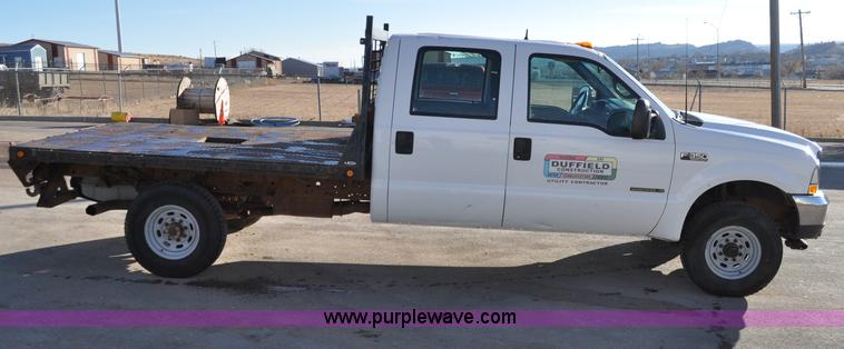 image for item C3129 2002 Ford F350 XL Super Duty flatbed truck