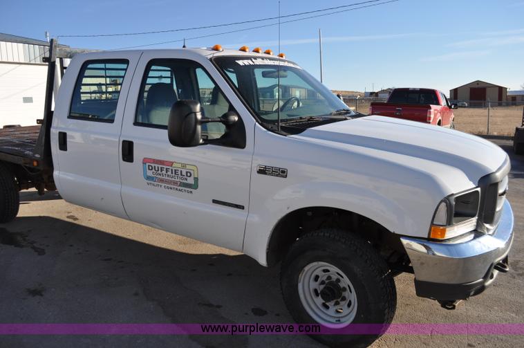 image for item C3129 2002 Ford F350 XL Super Duty flatbed truck