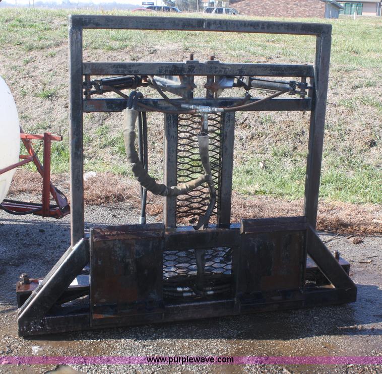 image for item F2764 Tree Terminator tree shear skid steer attachment