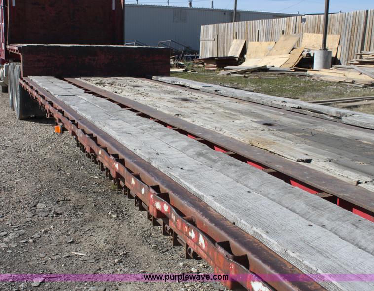 image for item E4225 1995 Daco dual tandem axle flatbed trailer