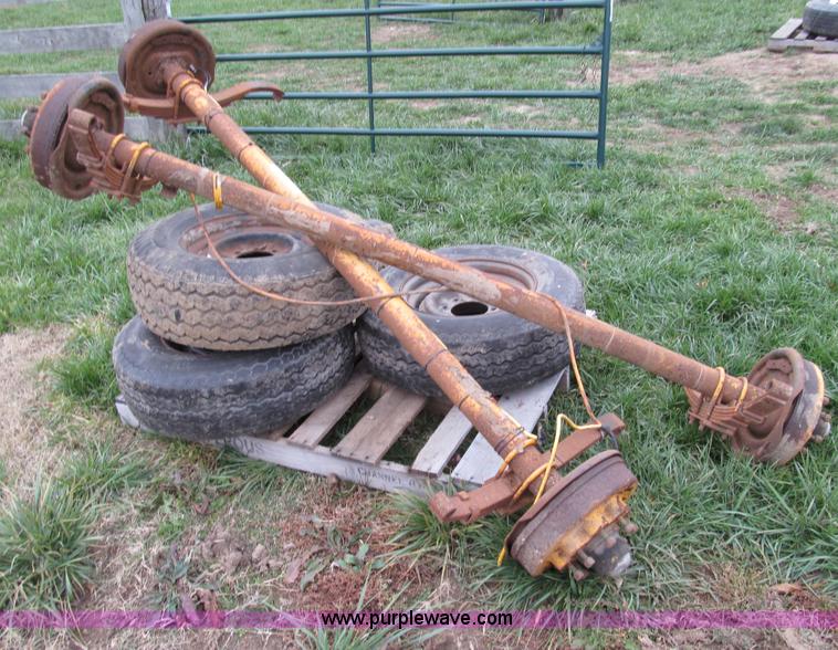 image for item O9051 (2) 7,500 lbs trailer axles with wheels and tires