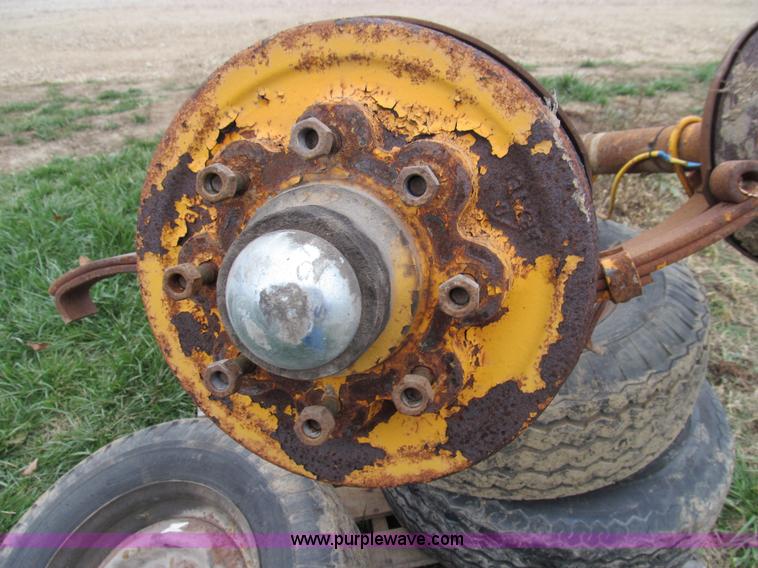 image for item O9051 (2) 7,500 lbs trailer axles with wheels and tires