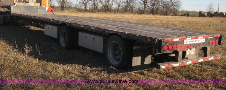image for item B8486 2004 Transcraft step deck flatbed trailer