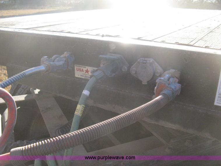 image for item B8486 2004 Transcraft step deck flatbed trailer