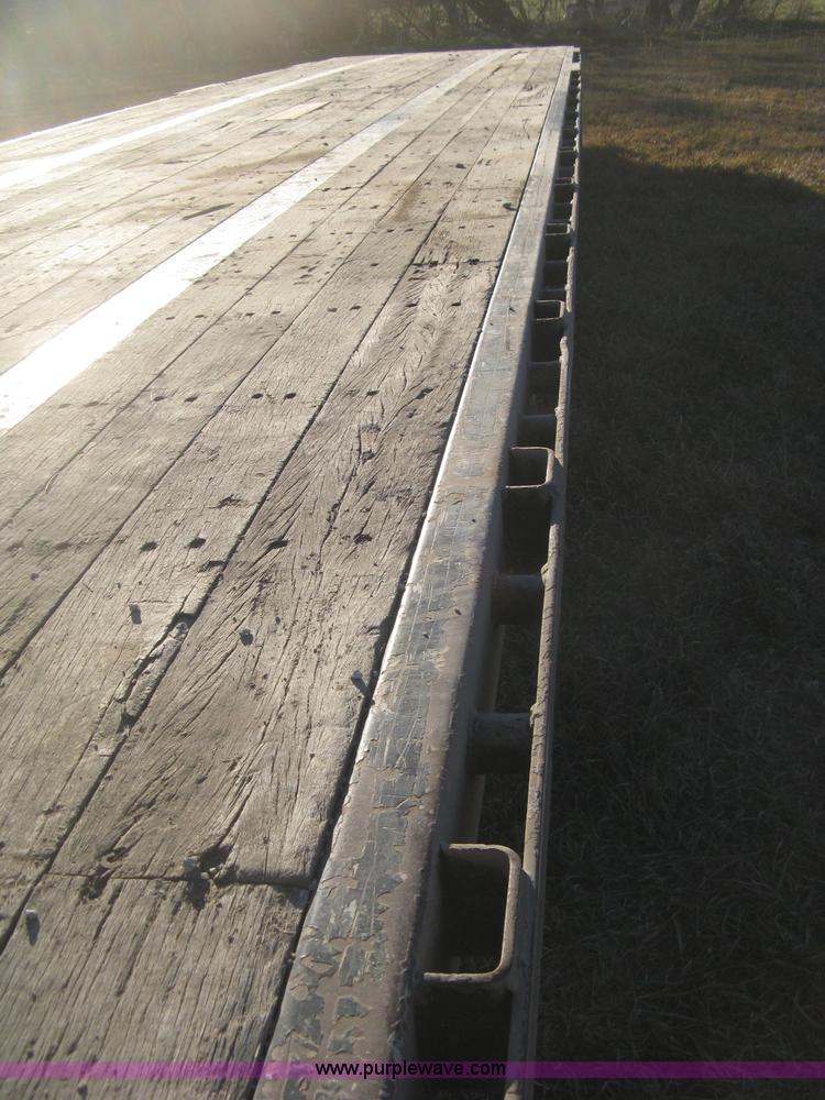 image for item B8486 2004 Transcraft step deck flatbed trailer