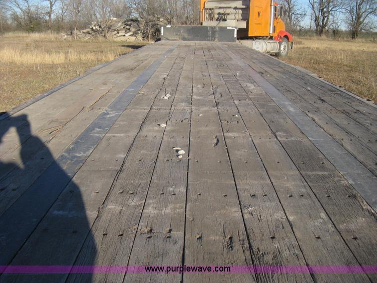 image for item B8486 2004 Transcraft step deck flatbed trailer