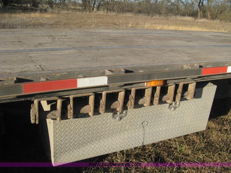 image for item B8486 2004 Transcraft step deck flatbed trailer