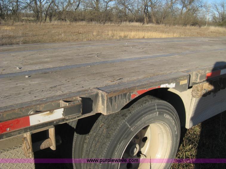 image for item B8486 2004 Transcraft step deck flatbed trailer