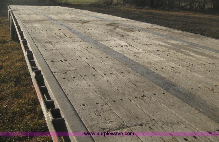 image for item B8486 2004 Transcraft step deck flatbed trailer