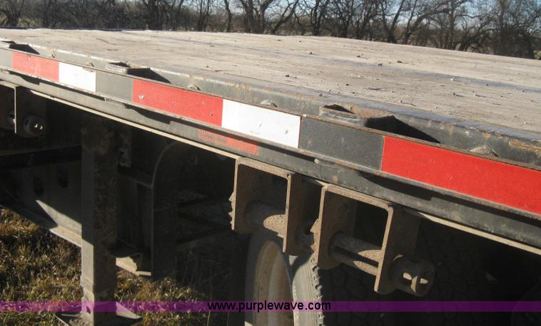image for item B8486 2004 Transcraft step deck flatbed trailer