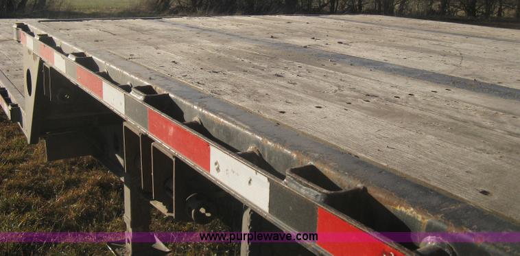 image for item B8486 2004 Transcraft step deck flatbed trailer