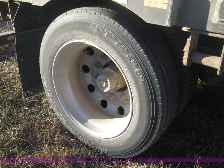 image for item B8486 2004 Transcraft step deck flatbed trailer