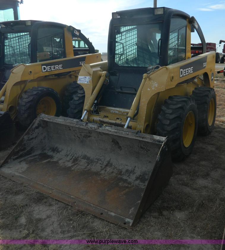 image for item G7666 2009 John Deere 320 skid steer