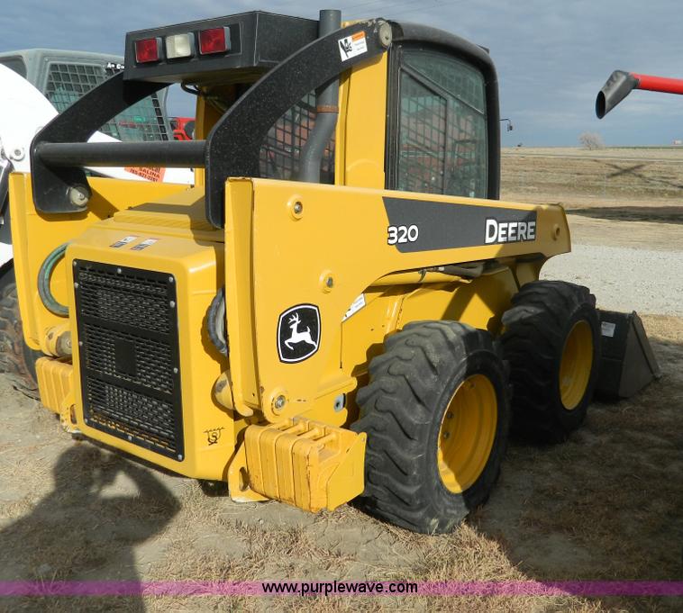 image for item G7666 2009 John Deere 320 skid steer