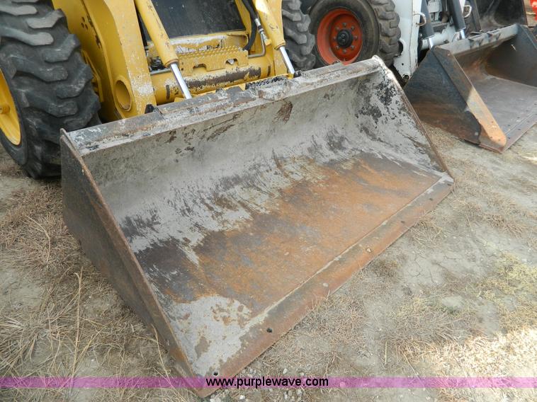 image for item G7666 2009 John Deere 320 skid steer