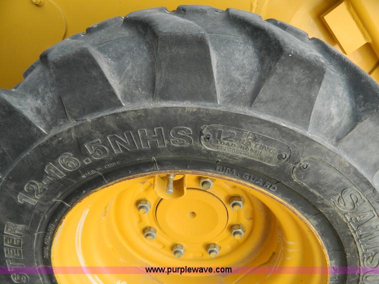 image for item G7666 2009 John Deere 320 skid steer