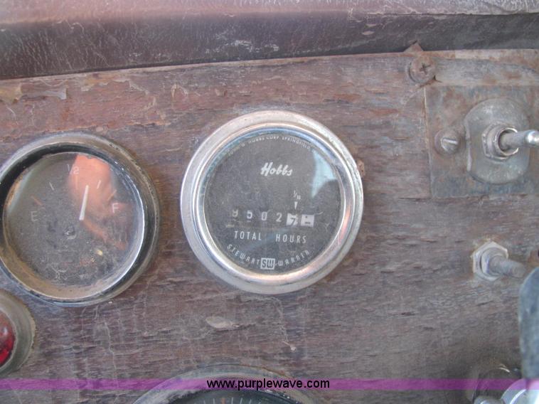 image for item E2790 1974 White Star Western 4864-2 tandem axle roll back truck