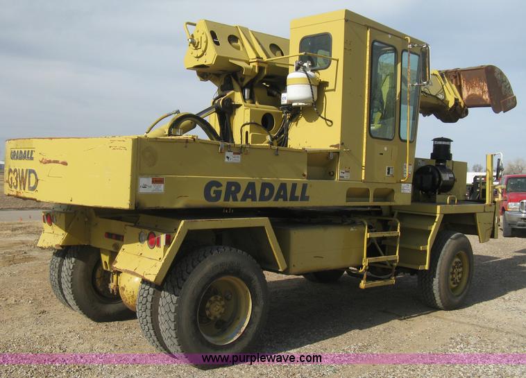image for item B8499 Gradall G3WD rubber tire hydraulic excavator