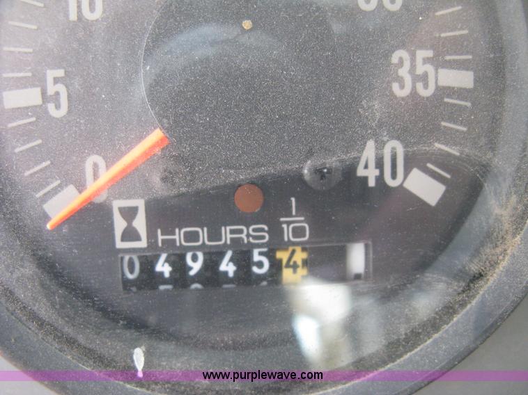 image for item B8499 Gradall G3WD rubber tire hydraulic excavator