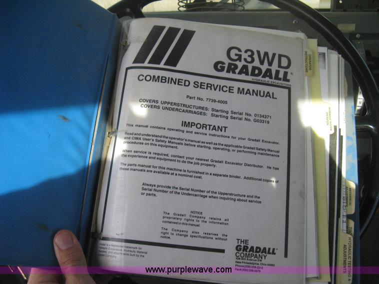 image for item B8499 Gradall G3WD rubber tire hydraulic excavator