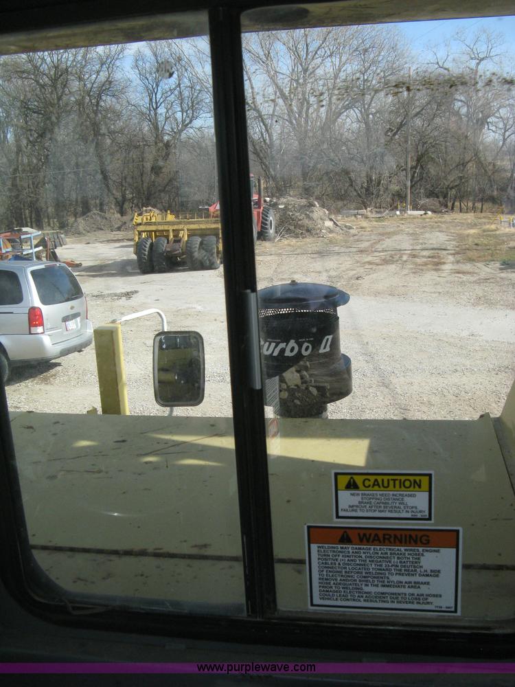 image for item B8499 Gradall G3WD rubber tire hydraulic excavator