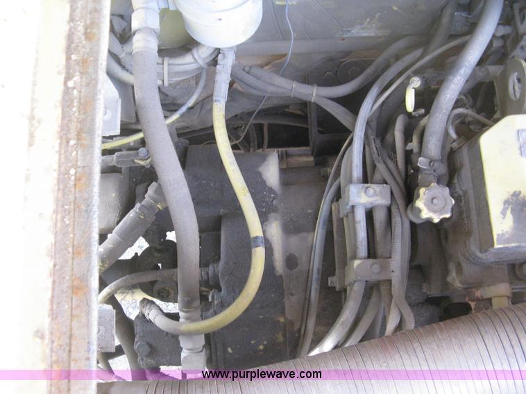 image for item B8499 Gradall G3WD rubber tire hydraulic excavator