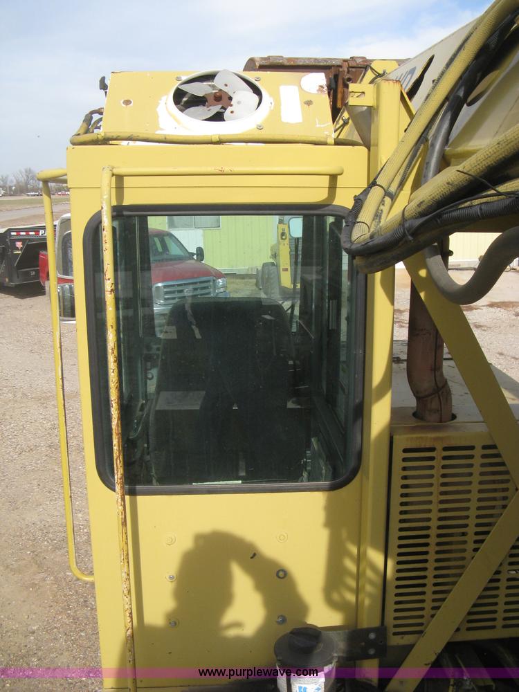 image for item B8499 Gradall G3WD rubber tire hydraulic excavator