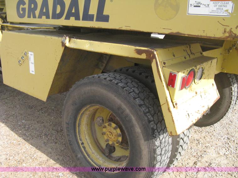 image for item B8499 Gradall G3WD rubber tire hydraulic excavator