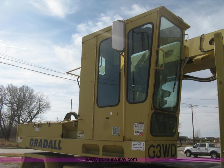 image for item B8499 Gradall G3WD rubber tire hydraulic excavator