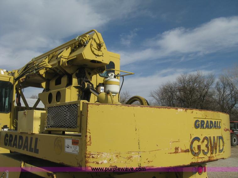 image for item B8499 Gradall G3WD rubber tire hydraulic excavator