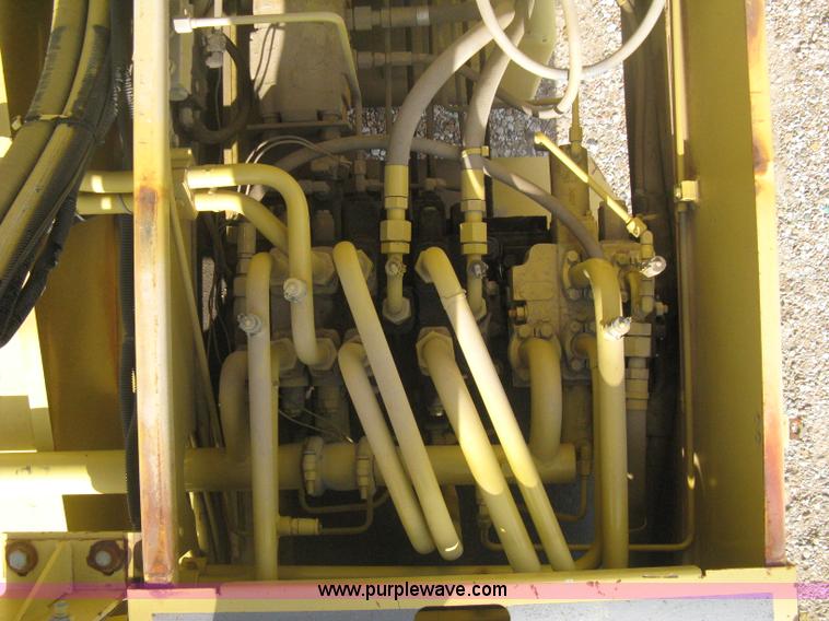 image for item B8499 Gradall G3WD rubber tire hydraulic excavator