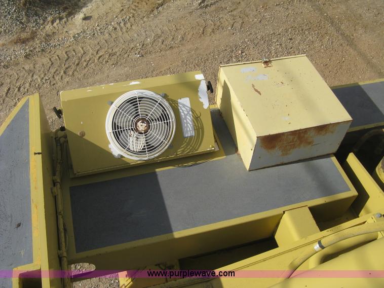 image for item B8499 Gradall G3WD rubber tire hydraulic excavator