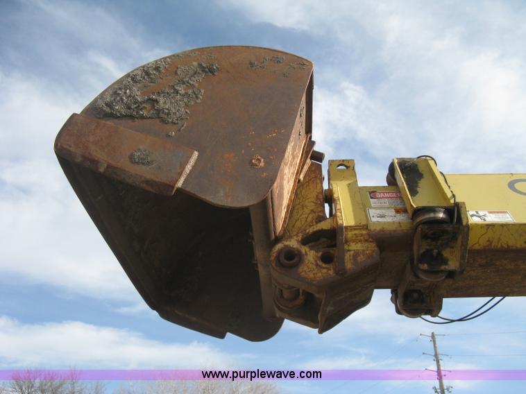 image for item B8499 Gradall G3WD rubber tire hydraulic excavator