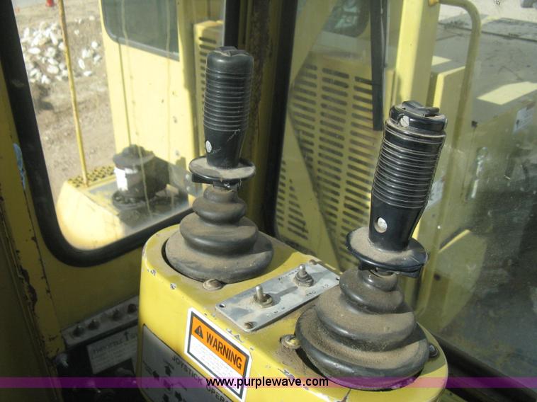 image for item B8499 Gradall G3WD rubber tire hydraulic excavator