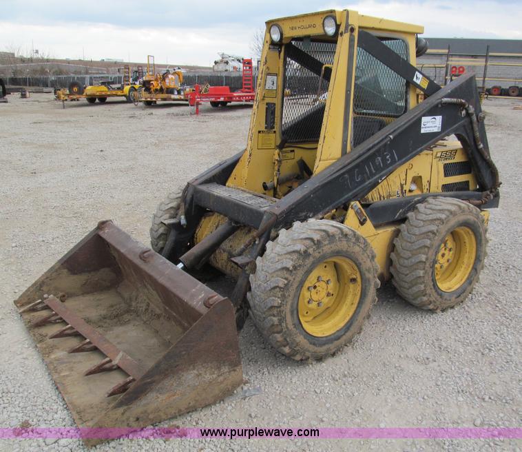 image for item E5770 1987 New Holland L555 Deluxe skid steer