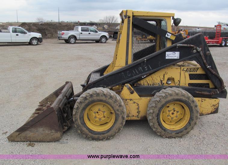image for item E5770 1987 New Holland L555 Deluxe skid steer