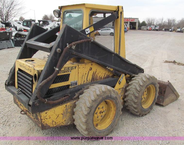 image for item E5770 1987 New Holland L555 Deluxe skid steer