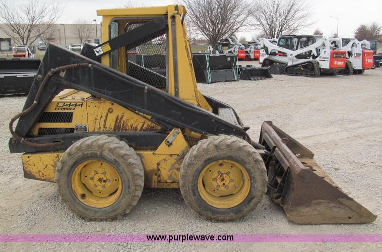 image for item E5770 1987 New Holland L555 Deluxe skid steer