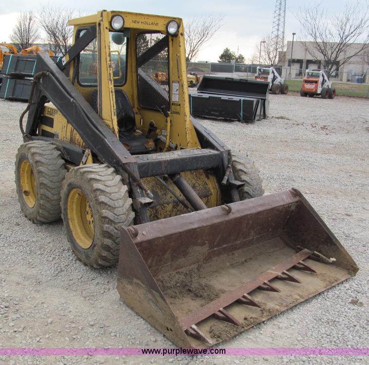 image for item E5770 1987 New Holland L555 Deluxe skid steer