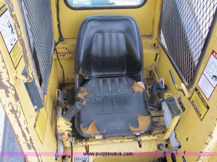 image for item E5770 1987 New Holland L555 Deluxe skid steer