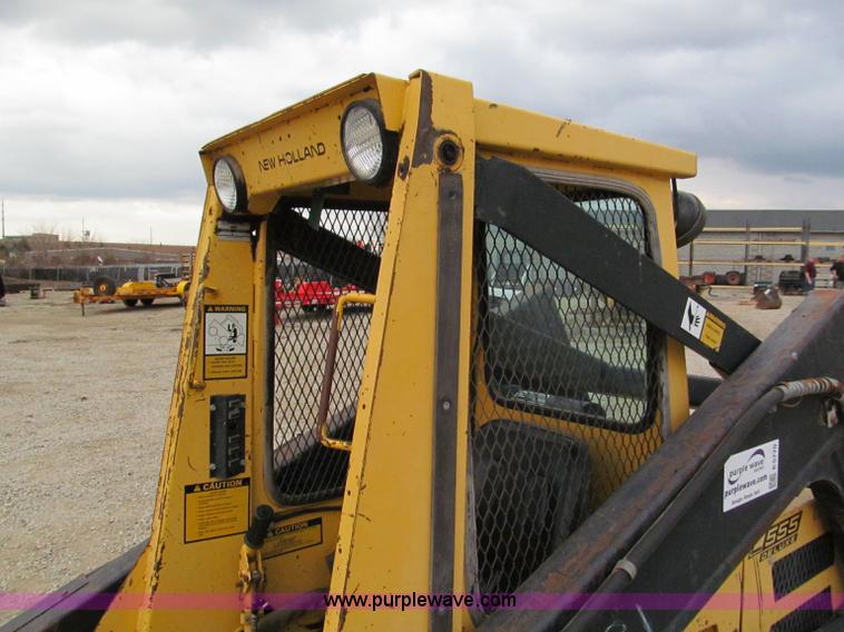 image for item E5770 1987 New Holland L555 Deluxe skid steer