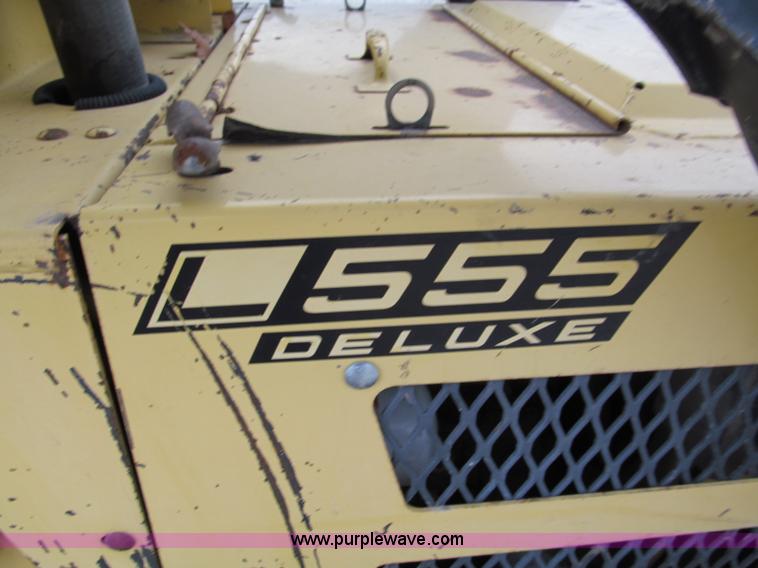 image for item E5770 1987 New Holland L555 Deluxe skid steer