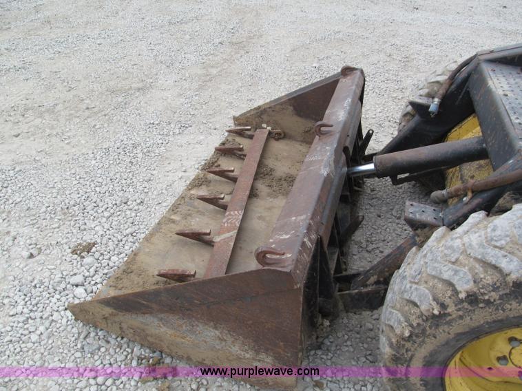 image for item E5770 1987 New Holland L555 Deluxe skid steer