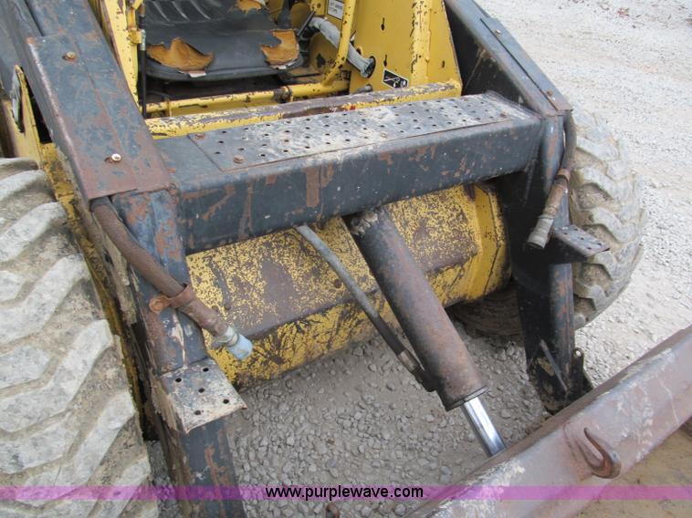 image for item E5770 1987 New Holland L555 Deluxe skid steer