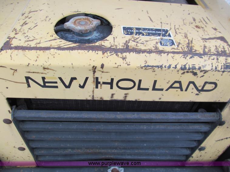 image for item E5770 1987 New Holland L555 Deluxe skid steer