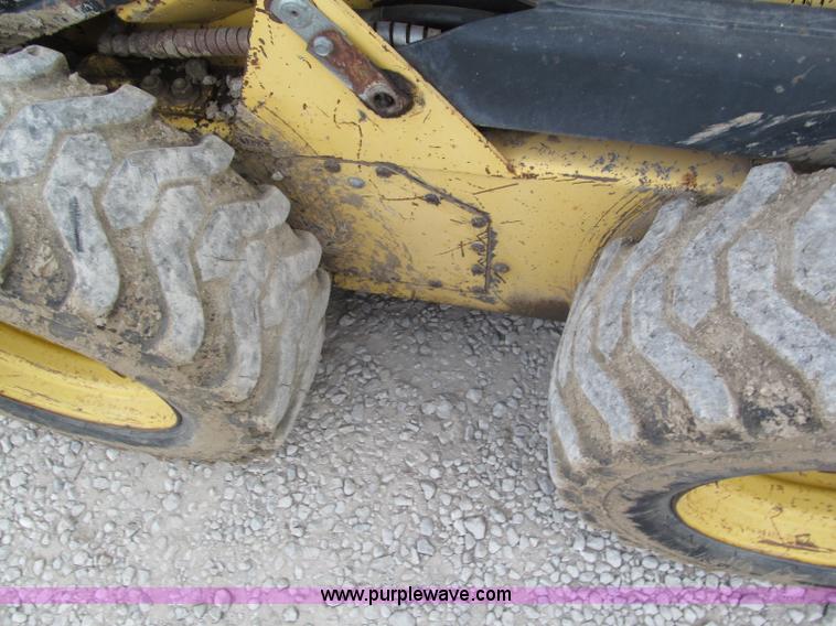 image for item E5770 1987 New Holland L555 Deluxe skid steer